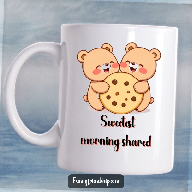 Funny mug showing two cute bear characters joyfully sharing a very large cookie, embodying friendship and happiness.
