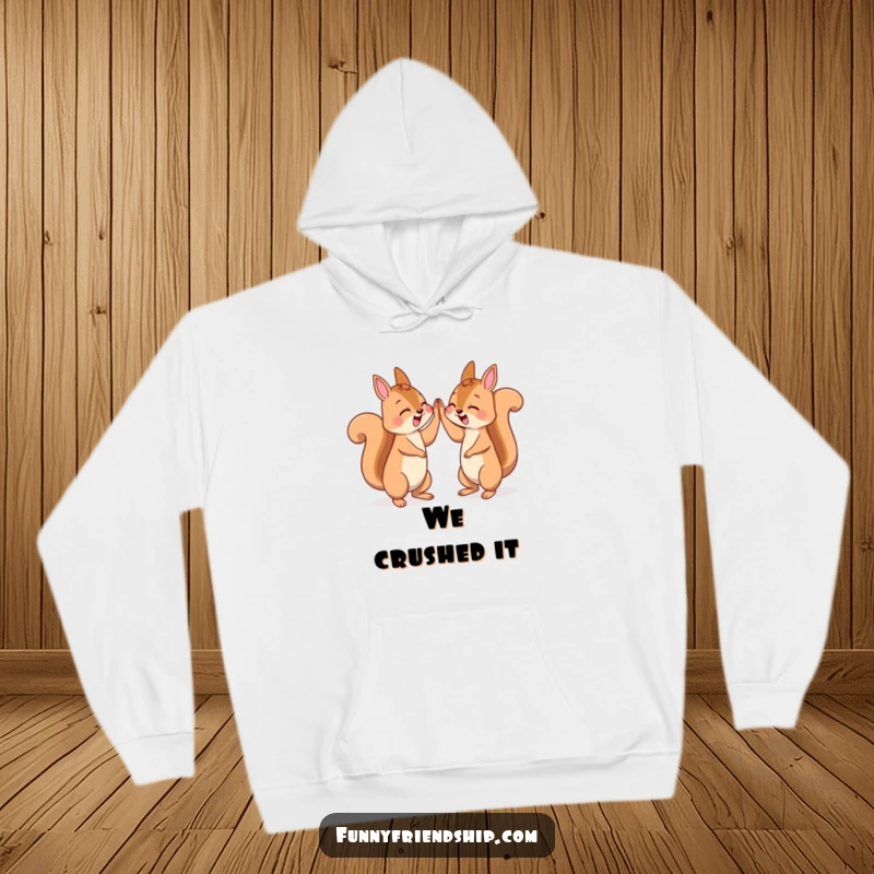 Funny hoodie depicting two squirrels sharing an energetic high five, signifying celebration and camaraderie.