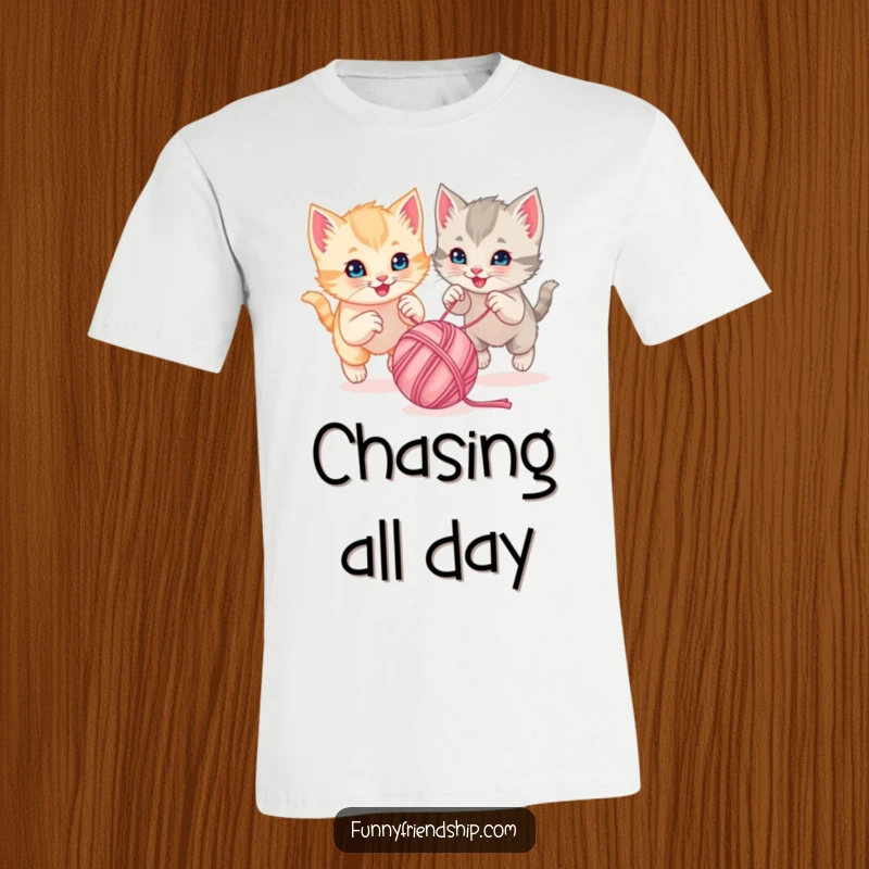 Funny playful kittens chasing a bouncing ball of yarn together on a soft cotton t-shirt, a cute animal graphic tee